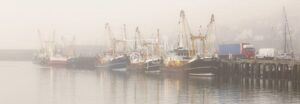 Trawlers on a misty morning in Newlyn Harbour, Cornwall, England, UK.