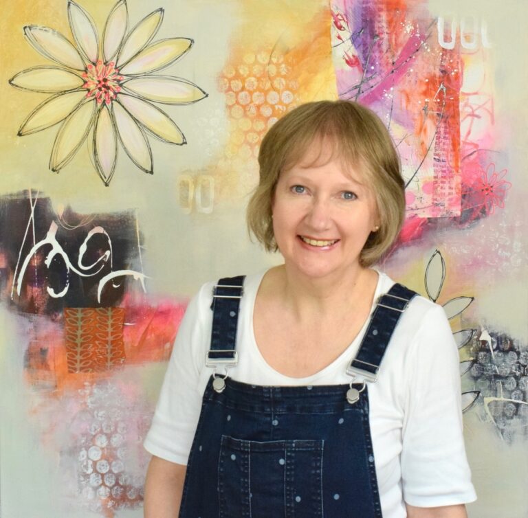Image of Alison Gilbert in front of one of her paintings