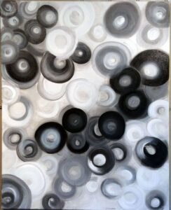 black, white and grey circles, some faded some more prominent.